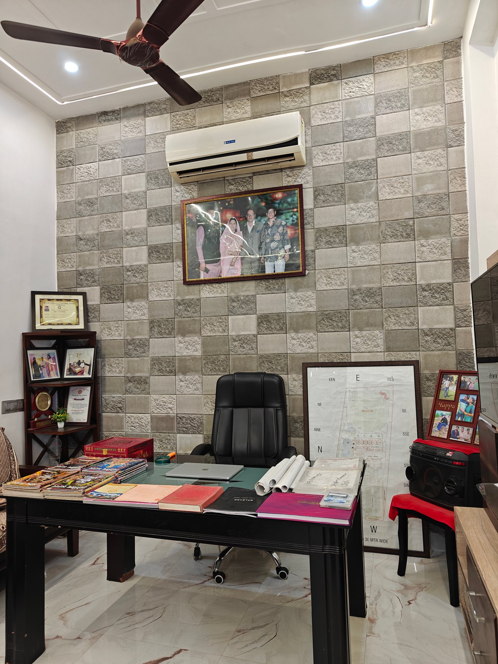 Consultation desk at Jyotirved Astrology, with birth charts and reference books